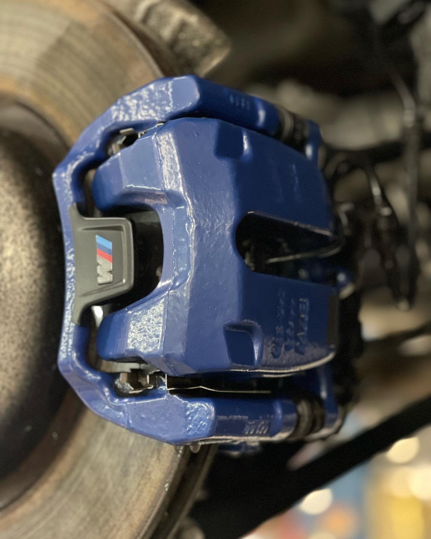 BMW M brake caliper after custom color refinish