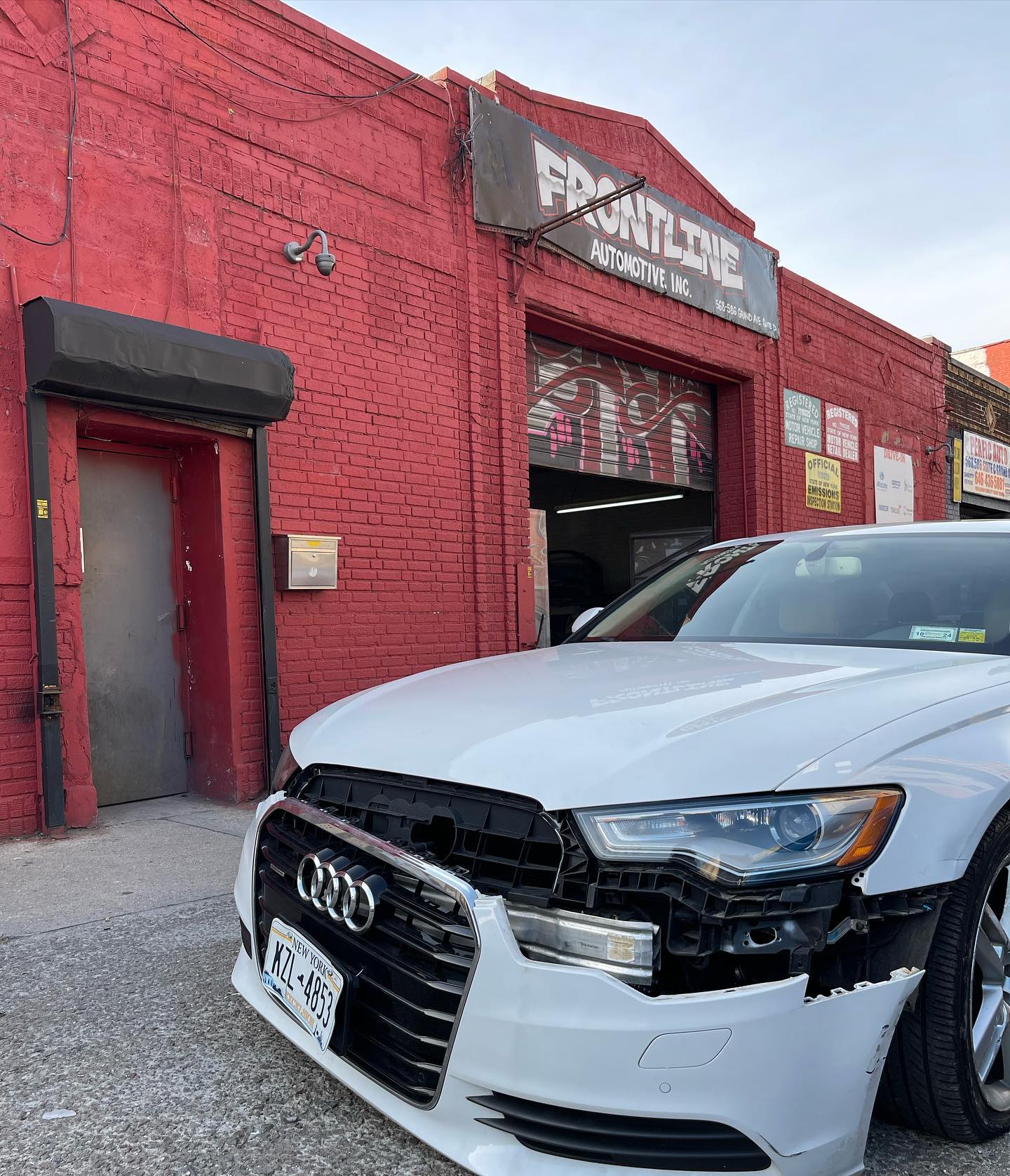 Audi A6 arriving at Frontline Automotive Brooklyn shop for collision intake
